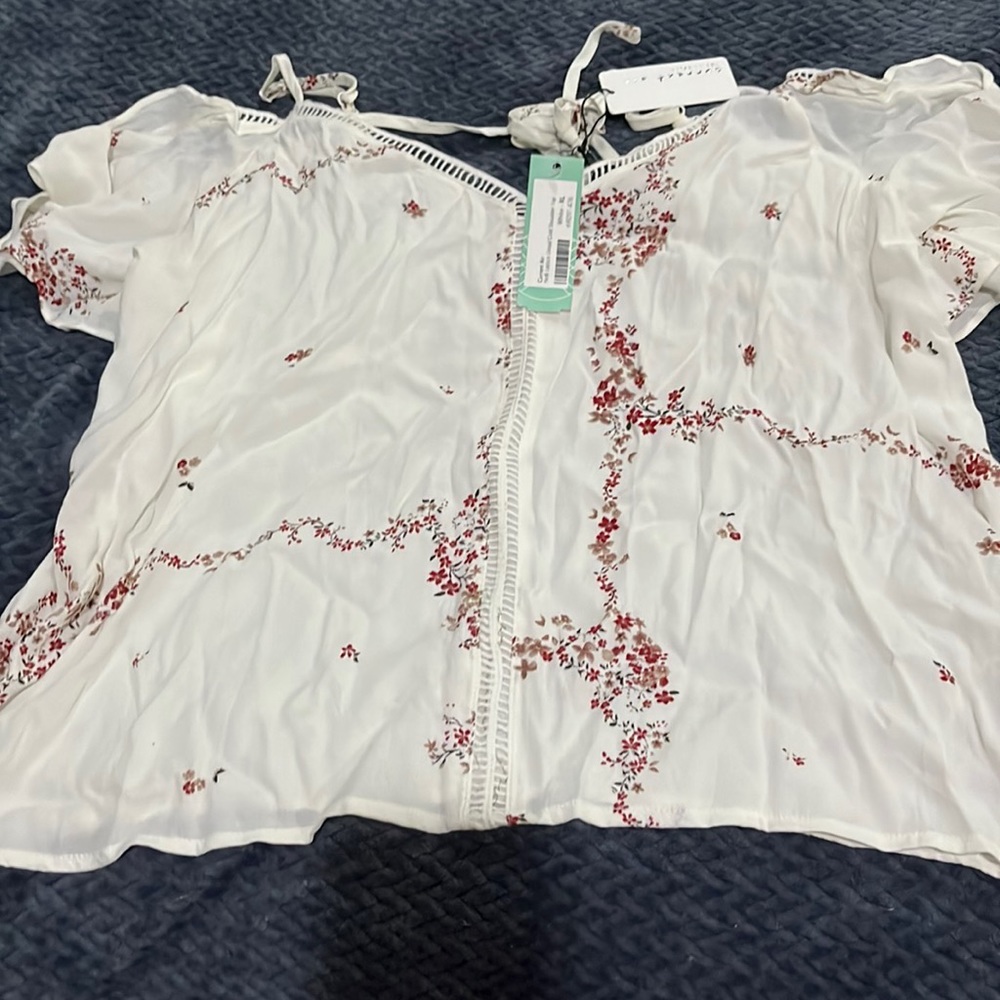 From stitch fix the brand is current air, cute cold shoulder cream, color, top.